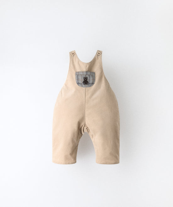 Peto bebé beige en pana elástica BCI con tirantes ajustables y diseño efecto globo Kala.