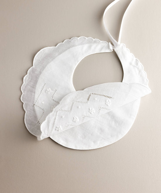 Embroidered hemstitch linen baby bib