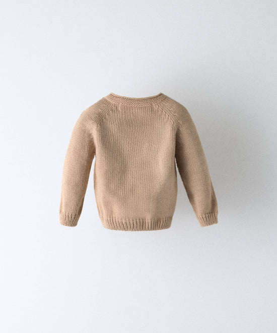 Parte trasera del jersey de punto de bebé beige — Kala